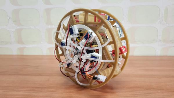 A partially edible rolling robot that uses pneumatic gelatine legs and an edible tilt sensor. 