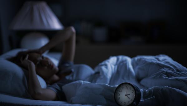 A women with sleep insomnia in bed