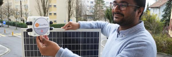 SmartHelio founder with a prototype of the IoT sensor