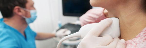 young woman undergoing an examination of thyroid